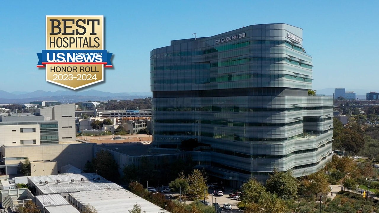 U.S. News & World Report's Honor Roll badge against the backdrop of the Jacobs Medical Center building seen from the top