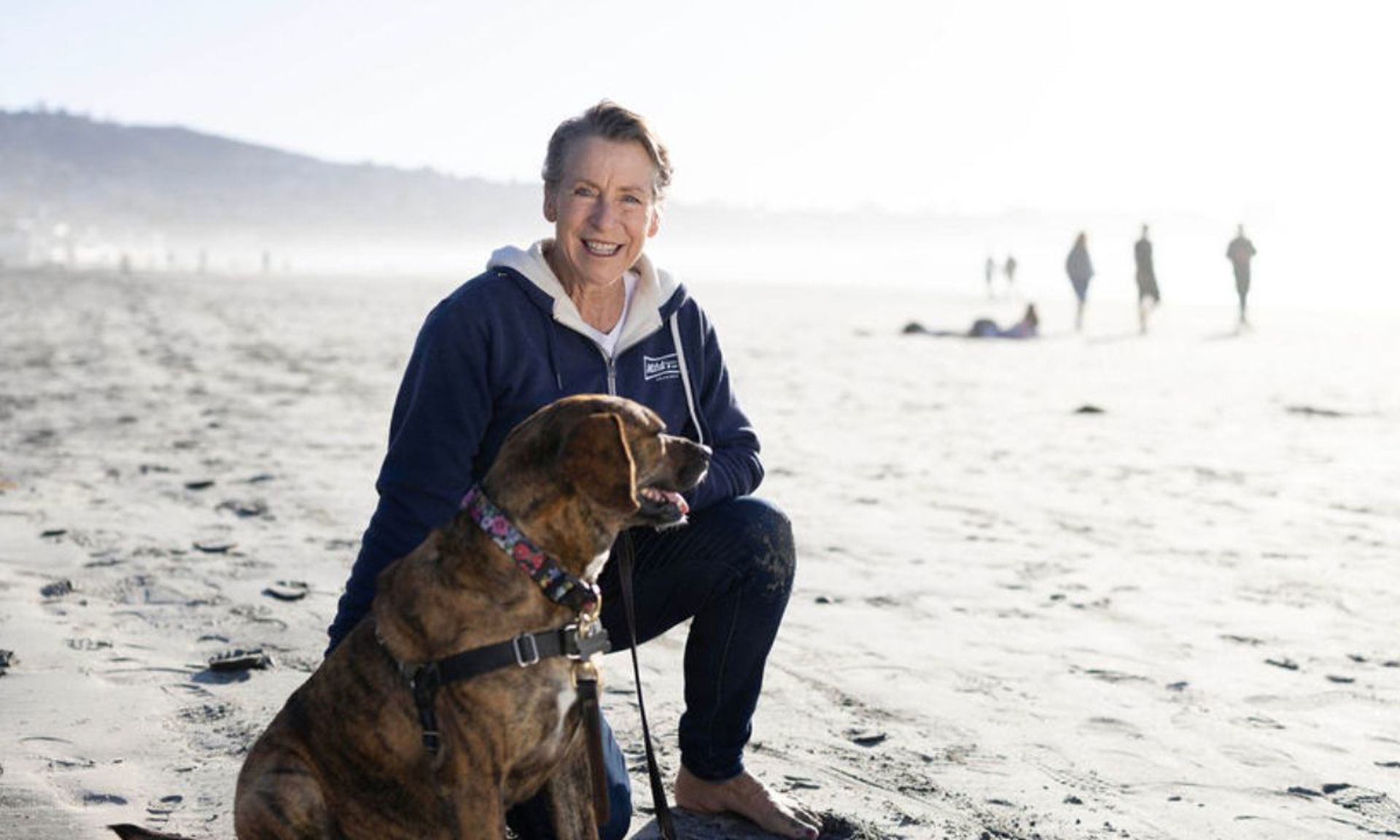 UC San Diego Health patient on beach with dog