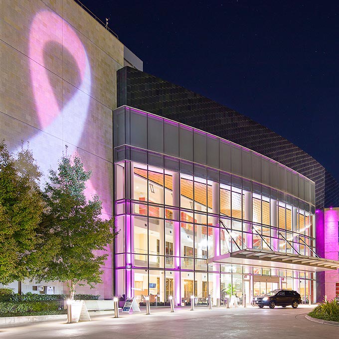 Moores Cancer Center with pink cancer awareness ribbon 