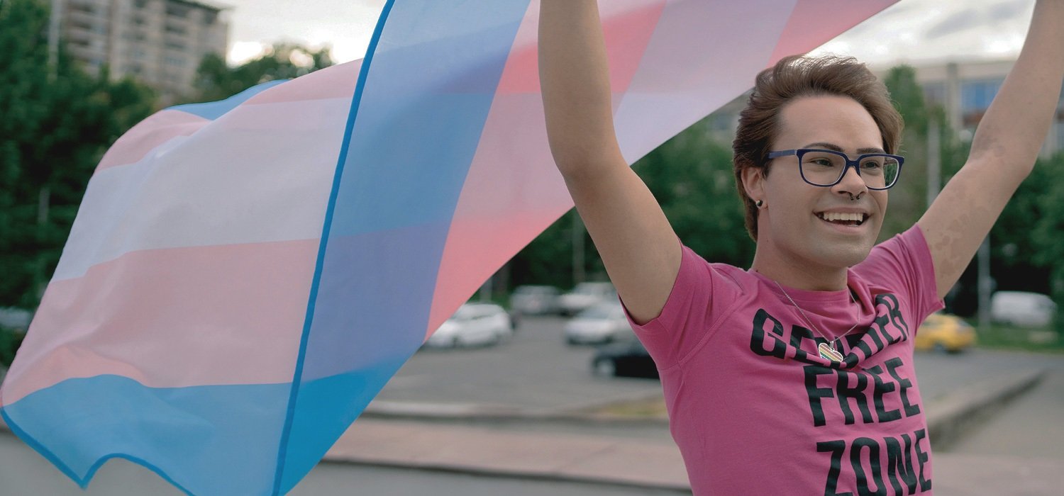 Person holding a Pride flag