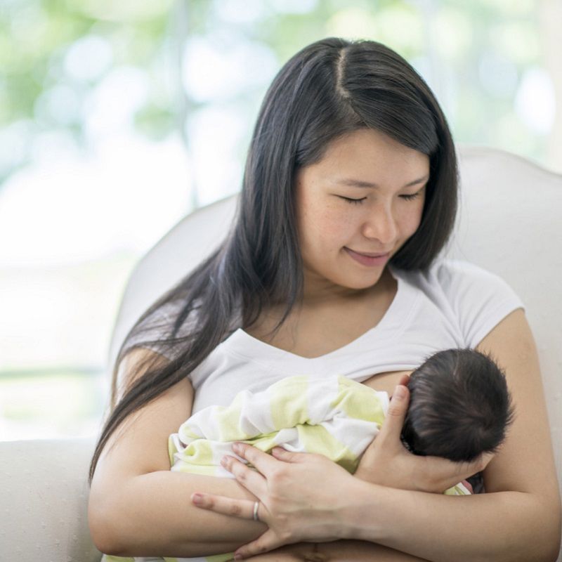 Mother and baby breastfeeding