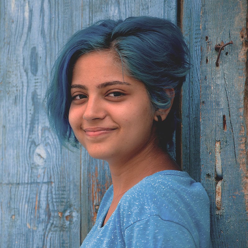 A young woman with blue hair 