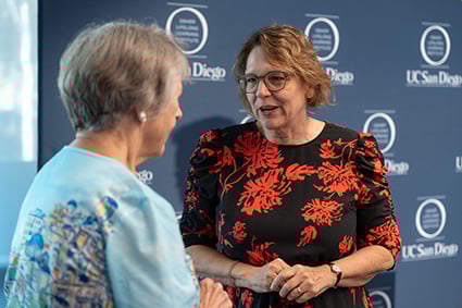 Dr. Alison Moore speaking with elder person