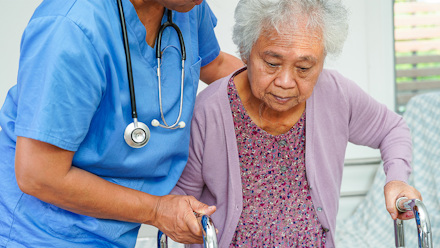 nurse helps senior patient