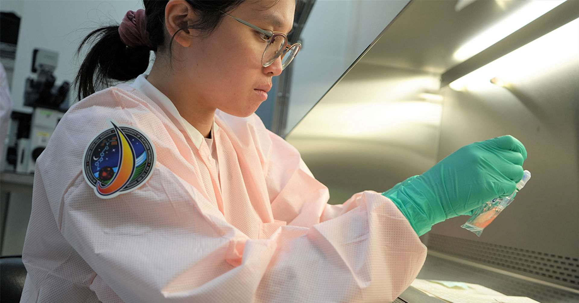 Researchers at the UC San Diego Sanford Stem Cell Institute evaluate cell samples after they have returned from low Earth orbit.