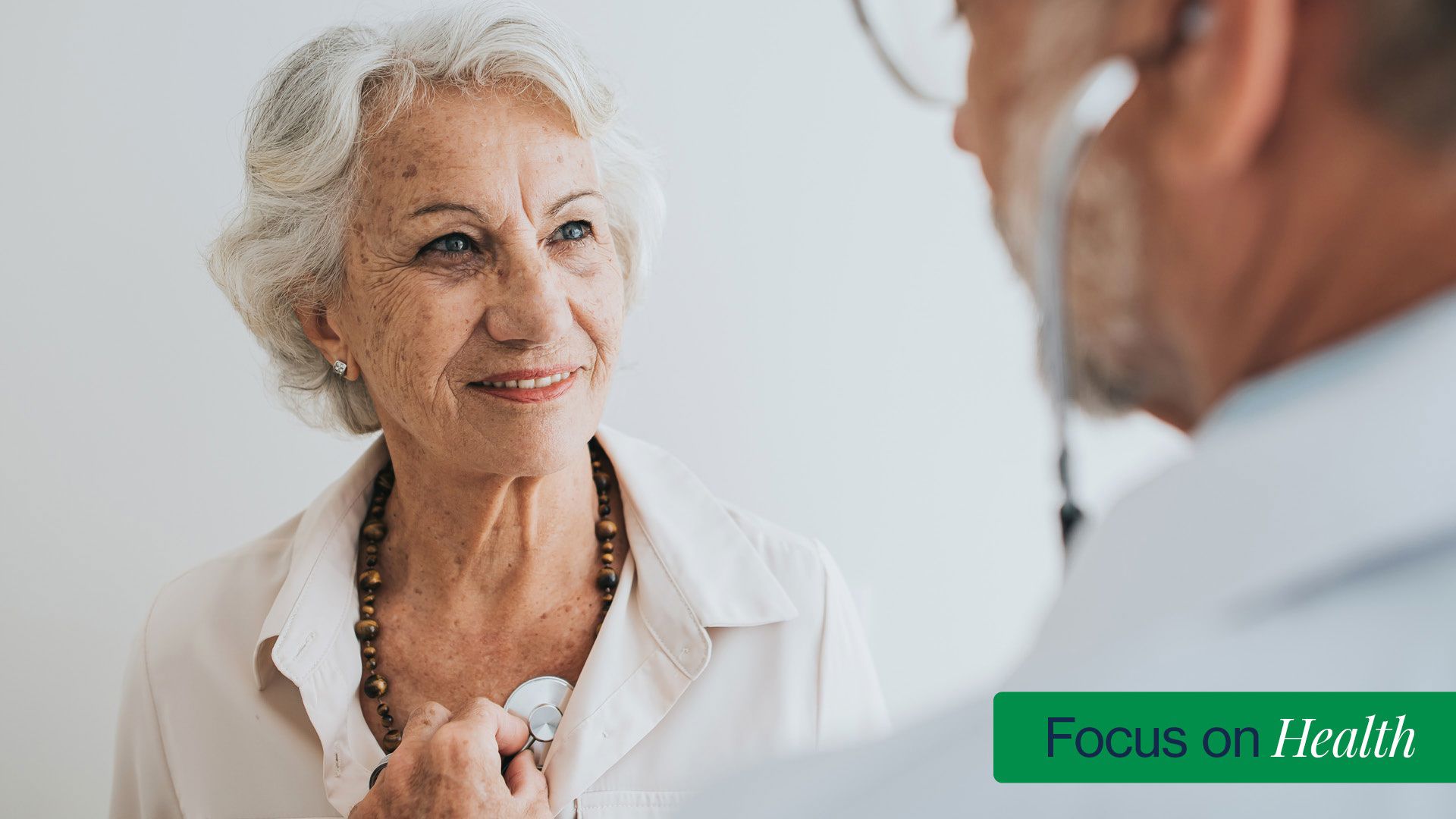 Senior female patient with male doctor