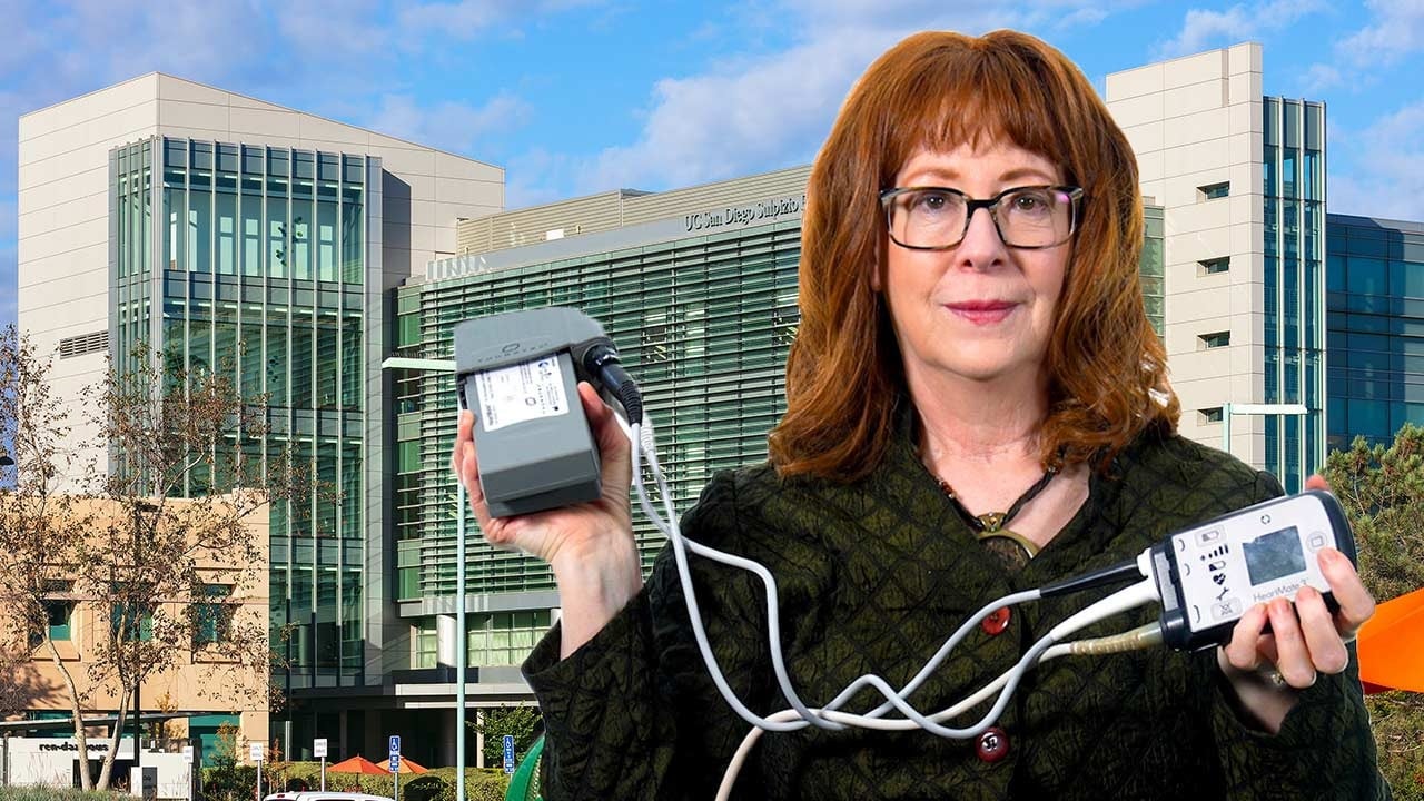Patient Hortencia Wagner holding a ventricular assist device (VAD)
