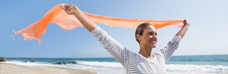 woman wearing scarf on beach
